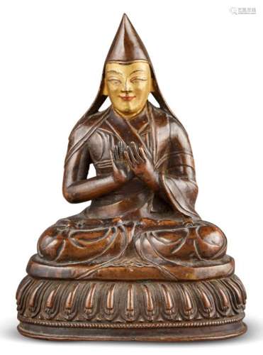 A Tibetan Bronze Figure of a Lama Height x 