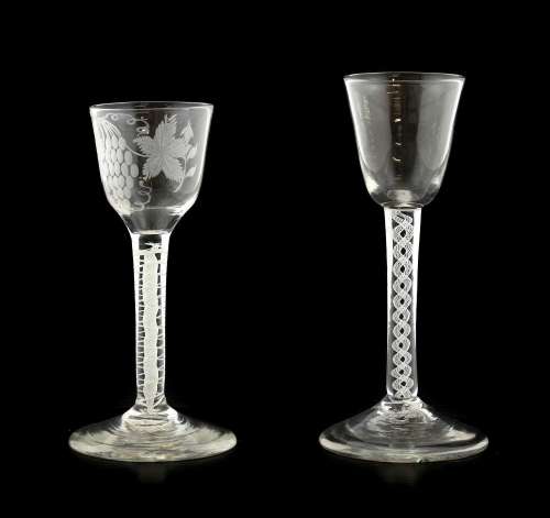 A Wine Glass, circa 1750, the rounded funnel bowl on an opaq...