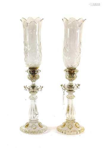 A Pair of Baccarat Candle Holders, the fluted urn-shaped soc...