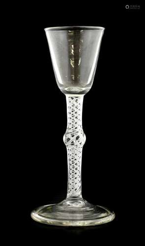 A Mixed Twist Wine Glass, circa 1750, the rounded funnel bow...