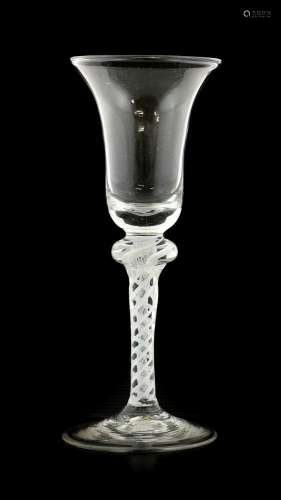An Opaque Twist Wine Glass, circa 1750, the bell-shaped bowl...