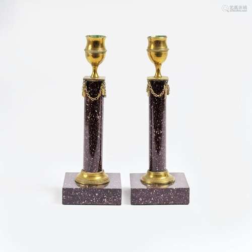 A Pair of Gustavian Blyberg Porphyry Candlesticks.