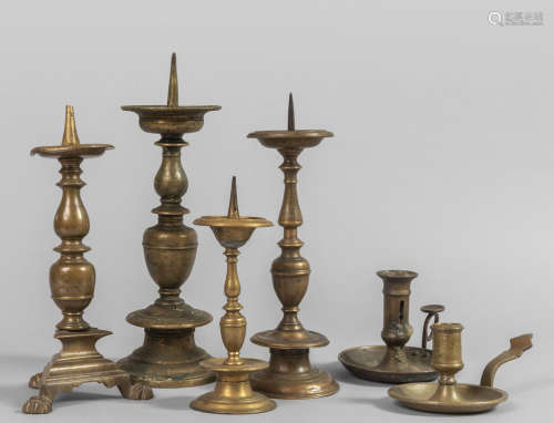 Quatttro candelieri in bronzo dorato e brunito