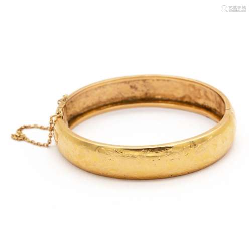 Bracelet jonc rigide ouvrant en or jaune (750) 18K ciselé d'...
