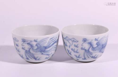 A pair of blue and white dragon style cups