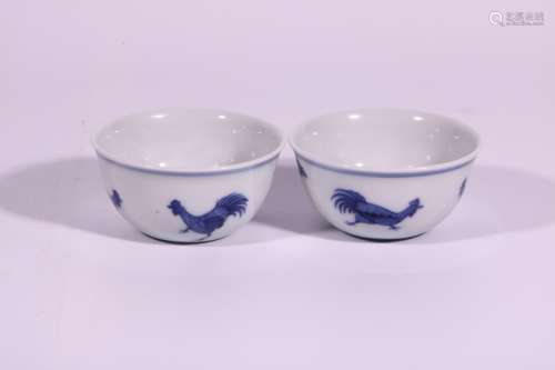 A pair of blue and white chicken cups