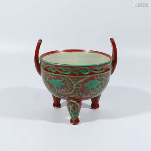 Three-legged incense burner with red background and green co...