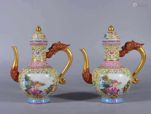 A pair of teapots with enamel and yellow ground wrapped arou...
