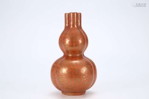 Red-glazed vase with golden lotus flowers and triplets