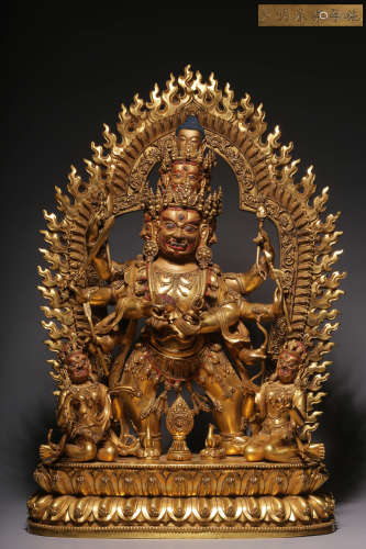 In the Qing Dynasty, a bronze gilt statue with eight arms an...