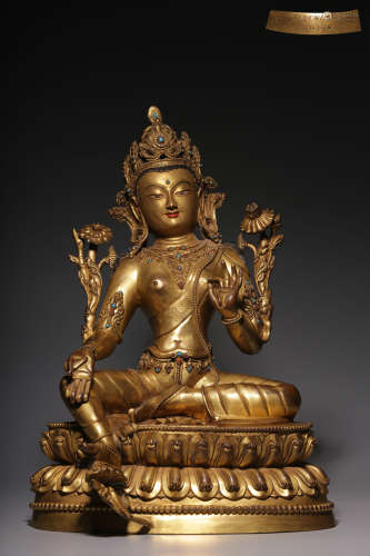 In the Qing Dynasty, a sitting Tara with gilt copper inlaid ...