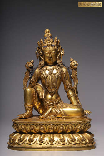 In the Qing Dynasty, a sitting statue of Guanyin in gilt cop...