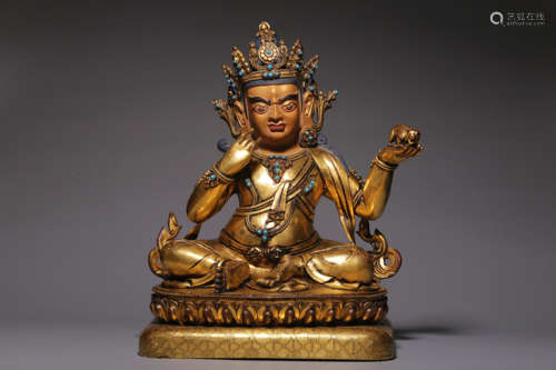 In the Qing Dynasty, a bronze gilt statue of the God of Weal...