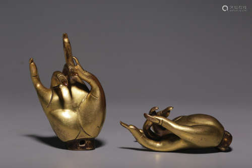 Qing Dynasty, a pair of copper gilt Buddha hands