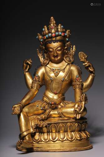 In the Qing Dynasty, a sitting statue of Guanyin with four a...