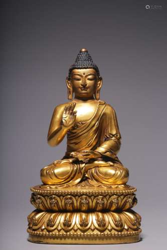 In the Qing Dynasty, the bronze gilt seated statue of the mo...