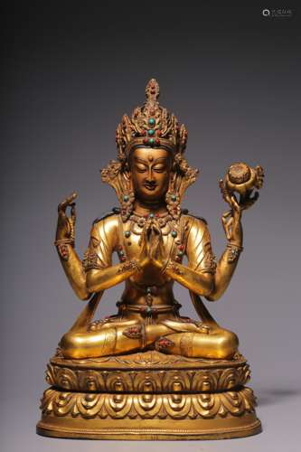 In the Qing Dynasty, a sitting statue of Guanyin with four a...