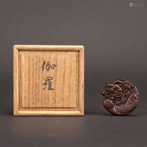 A CARVED CHENXIANG BI DISC WITH JAPANESE BOX