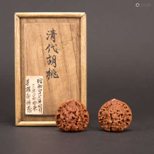 A PAIR OF WALNUTS WITH JAPANESE BOX