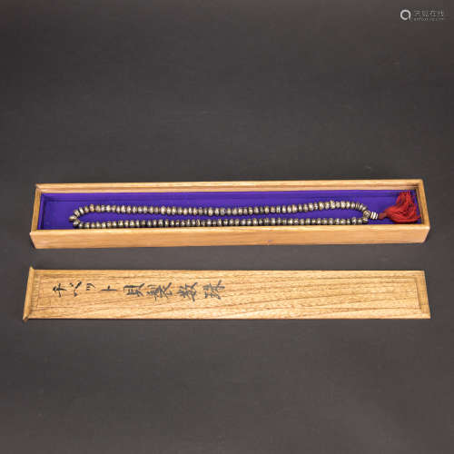 A STRING OF BEADS WITH JAPANESE BOX
