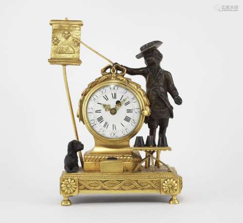 Petite pendule de style Louis XVI<br />
Bronze doré et patin...