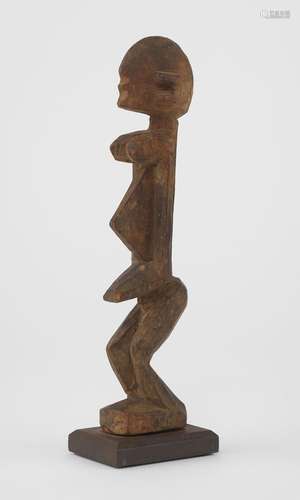 Statuette féminine Dogon, (Mali)<br />
Bois à patine brune, ...