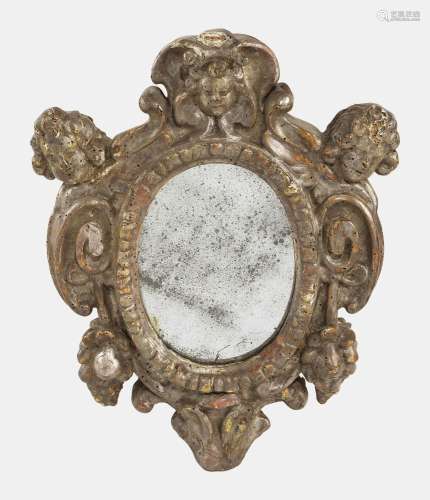 Miroir ovale, Italie, XVIIIe s<br />
Bois sculpté et argenté...