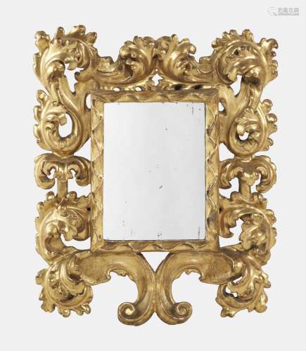 Miroir rococo, Italie, XVIIIe s<br />
Bois sculpté et doré à...