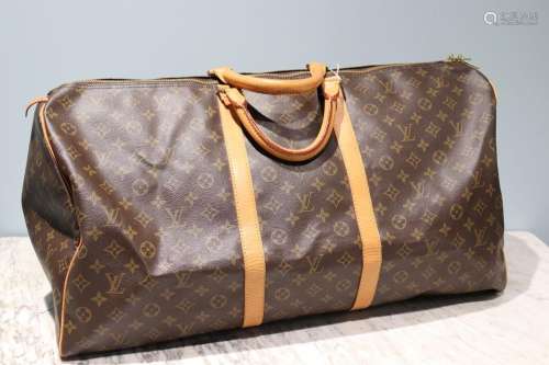 LOUIS VUITTON - SAC modèle "Keepall" 60 cm en toil...