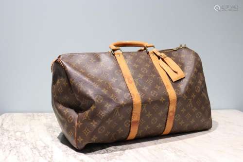 LOUIS VUITTON - SAC modèle "Keepall" 45 cm en toil...