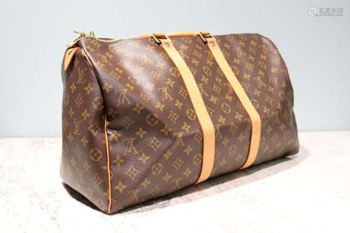 LOUIS VUITTON - SAC modèle "Keepall" 45 cm en toil...