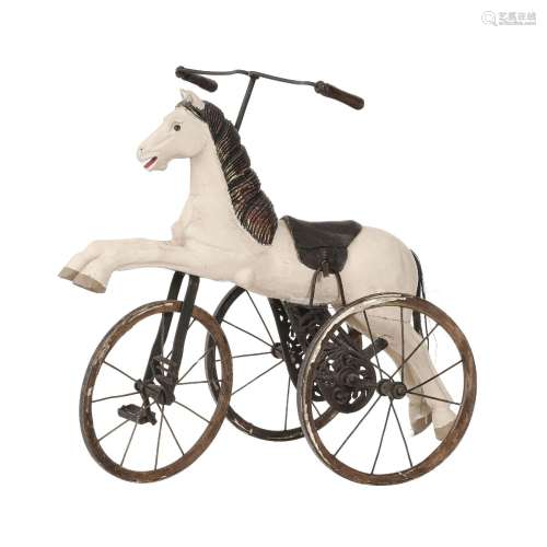 Tricycle, début du XXe s., en forme de cheval en bois peint ...