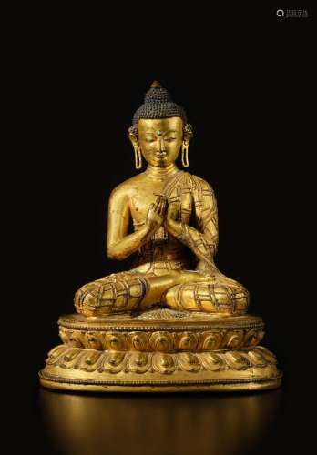 . A gilt-copper alloy figure of Shakyamuni Buddha, Nepal or ...