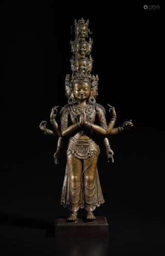 . A large silver- and copper-inlaid copper alloy figure of A...