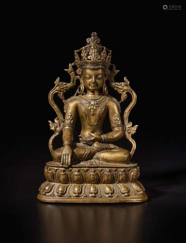 . A copper alloy figure of Akshobya Buddha, Tibet, 14th cent...