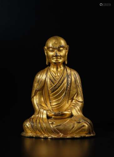 . A gilt-bronze figure of Kasyapa, Liao Dynasty | 遼 銅鎏金迦...