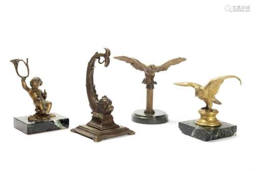 Lot consisting of four bronze watch holders, early 20th cent...