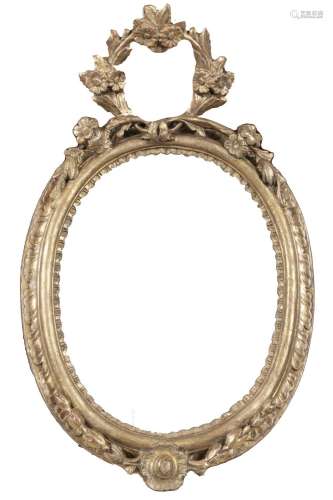 Oval frame in carved and gilded wood, with gable on the top