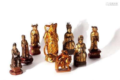 Lot consisting of eight lacquered and gilded wood sculptures...