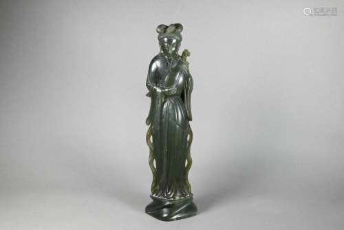 A Chinese green soapstone figure of a courtesan playing a pi...