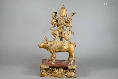 A Thai gilded bronze Shiva kneeling on the Nandi Bull