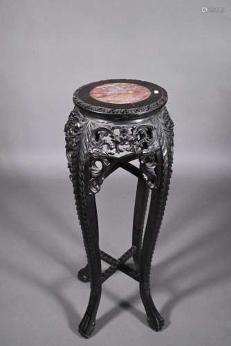 An antique Chinese carved and moulded hardwood stand