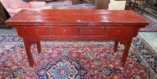 An antique Chinese red lacquer four drawer side table
