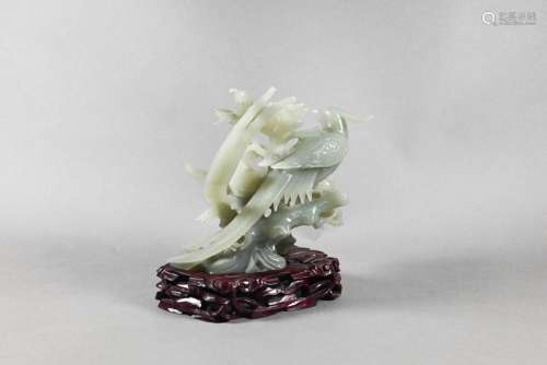 A Chinese celadon 'new jade' bowenite ornament carve...