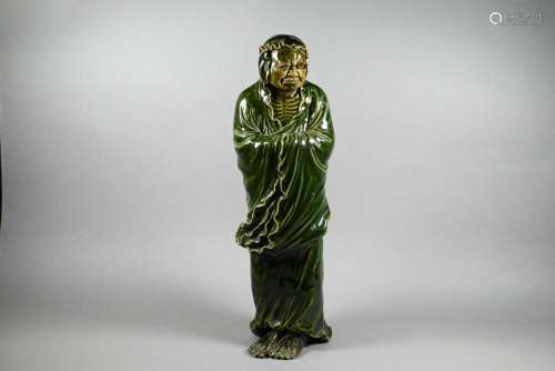 A 19th century Chinese green-glazed ceramic Luohan, Qing dyn...