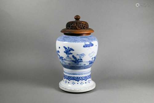 A Chinese blue and white vase with carved and pierced cover,...