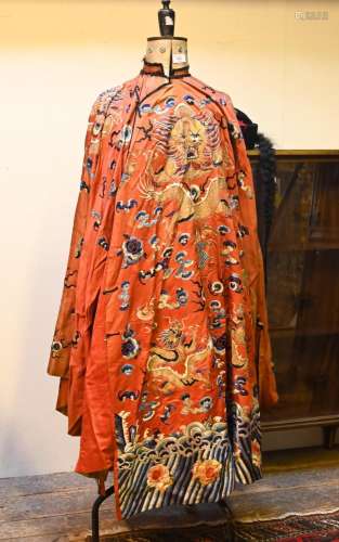 A Chinese red ground dragon robe, pleated apron skirt and tw...
