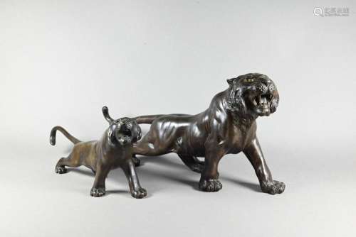 Two Japanese Meiji period bronze tigers, one signed Seiya