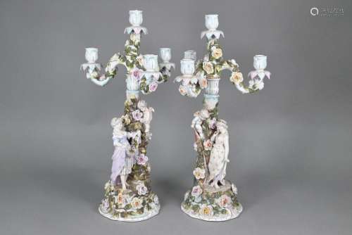 A pair of Sitzendorf porcelain floral-encrusted candelabra