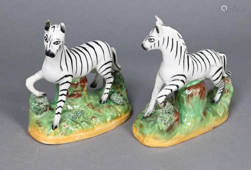 A pair of 19th century Staffordshire pottery zebras